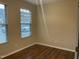 Neutral bedroom with carpet, blinds, natural light from two windows, and electrical outlets at 4469 Middletown Dr, Wake Forest, NC 27587