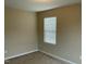 Neutral bedroom featuring a window for natural light and neutral carpeting at 4469 Middletown Dr, Wake Forest, NC 27587