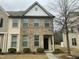 Charming two-story home with a brick and vinyl exterior and manicured landscaping at 4469 Middletown Dr, Wake Forest, NC 27587