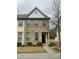 Attractive two-story home with brick and vinyl siding, complemented by green shrubbery at 4469 Middletown Dr, Wake Forest, NC 27587
