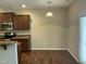 Kitchen area with wooden cabinets, stainless appliances, and a sliding door to the backyard at 4469 Middletown Dr, Wake Forest, NC 27587