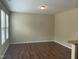 Bright, open living room with hardwood floors and a neutral color palette at 4469 Middletown Dr, Wake Forest, NC 27587