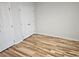 Light and airy bedroom with hardwood floors and a double door closet at 4604 Sweet Melody Ln, Knightdale, NC 27545