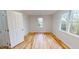 A bedroom with hardwood floors and natural light at 4604 Sweet Melody Ln, Knightdale, NC 27545
