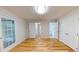 This bedroom boasts gleaming hardwood floors, ample storage, and glass french doors at 4604 Sweet Melody Ln, Knightdale, NC 27545