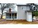 Side view of a home with a screened-in porch, an exterior door, and brick accents at 4604 Sweet Melody Ln, Knightdale, NC 27545