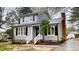 Traditional two-story home featuring classic architecture, tidy landscaping, and inviting front porch at 4604 Sweet Melody Ln, Knightdale, NC 27545