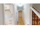 Hallway leading to other parts of the home, with views of kitchen and staircase at 4604 Sweet Melody Ln, Knightdale, NC 27545
