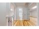 Hardwood hallway leading to a bathroom and bedroom at 4604 Sweet Melody Ln, Knightdale, NC 27545
