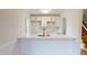 Kitchen with white cabinets, gold hardware, modern finishes, and marble countertops at 4604 Sweet Melody Ln, Knightdale, NC 27545