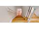 A staircase with hardwood steps and decorative wrought iron spindles at 4604 Sweet Melody Ln, Knightdale, NC 27545