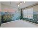 Bedroom with a nature mural, neutral carpet, and a window with blinds at 4709 Delta Lake Dr, Raleigh, NC 27612