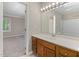 Bathroom vanity with large mirror and decorative lighting at 502 Forest Court, Carrboro, NC 27510
