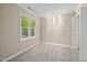 Bright bedroom with large window and neutral walls at 502 Forest Court, Carrboro, NC 27510