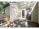 Wooden deck area attached to the home and overlooking the yard, featuring a sliding glass door at 502 Forest Court, Carrboro, NC 27510