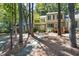 Exterior view of a townhome with beautiful trees and a sidewalk leading to the front door at 502 Forest Court, Carrboro, NC 27510
