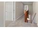 Hallway on upper level with carpet flooring and wood railing at 502 Forest Court, Carrboro, NC 27510