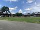 View of the Carborro Town Commons with an open field and covered pavilions at 502 Forest Court, Carrboro, NC 27510