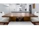 Dining area leading to kitchen with large table, white bench and chair seating at 543 Pine Ridge Place, Raleigh, NC 27609