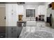 Bright kitchen featuring granite counters, stainless steel appliances, and a white farmhouse sink at 543 Pine Ridge Place, Raleigh, NC 27609