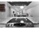 Kitchen with granite counters and stainless steel range, opening to the living/dining areas at 543 Pine Ridge Place, Raleigh, NC 27609