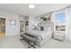 Spacious bedroom with ample natural light, a comfortable bed, and stylish decor at 600 Hedrick Ridge Road # 104, Cary, NC 27519
