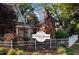 Charming Cotton House craft brewers with decorative sign, lush landscaping and white picket fence at 600 Hedrick Ridge Road # 104, Cary, NC 27519