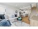 Cozy living room with a sectional sofa, glass coffee table, and a view of the kitchen and stairs at 600 Hedrick Ridge Road # 104, Cary, NC 27519