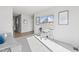 This flexible living space has an integrated office nook with white desk, grey chair, and views of the neighborhood at 600 Hedrick Ridge Road # 104, Cary, NC 27519