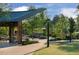 Outdoor pavilion area with seating, tables, and landscaped surroundings for community and leisure activities at 600 Hedrick Ridge Road # 104, Cary, NC 27519