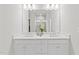 Modern bathroom featuring a double sink vanity, large mirror, and stylish fixtures, perfect for a contemporary home at 600 Hedrick Ridge Road # 108, Cary, NC 27519