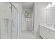 Bright bathroom showcasing a glass-enclosed shower, double vanity, and modern design elements for a clean, fresh feel at 600 Hedrick Ridge Road # 108, Cary, NC 27519