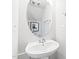 Elegant powder room features a pedestal sink, oval mirror, and modern fixtures, offering a stylish and functional space at 600 Hedrick Ridge Road # 108, Cary, NC 27519