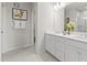 Elegant bathroom with a double sink vanity, large mirror, and sleek design, perfect for a modern home at 600 Hedrick Ridge Road # 108, Cary, NC 27519