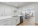Modern kitchen overlooking the dining and living areas, with a large island, perfect for entertaining guests at 600 Hedrick Ridge Road # 108, Cary, NC 27519