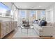 Stylish living room bathed in natural light, featuring a comfortable sectional sofa, modern furniture, and elegant decor at 600 Hedrick Ridge Road # 108, Cary, NC 27519