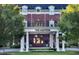 Elegant Mayton building featuring a classic brick facade, white pillars, and manicured landscaping at 600 Hedrick Ridge Road # 108, Cary, NC 27519