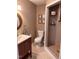 Cozy bathroom featuring a tiled walk-in shower and a wood vanity with a sink, creating a functional space at 601 Aiken Pkwy, Fuquay Varina, NC 27526