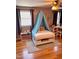 Whimsical bedroom with a canopy bed, colorful decor, and window views, perfect for a imaginative space at 601 Aiken Pkwy, Fuquay Varina, NC 27526