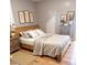Comfortable bedroom with a wood-frame bed, soft linens, neutral color scheme, and stylish decor, a relaxing retreat at 601 Aiken Pkwy, Fuquay Varina, NC 27526