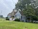 Inviting blue home with well-maintained lawn and mature trees at 601 Aiken Pkwy, Fuquay Varina, NC 27526