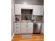 Clean kitchen with white cabinets, stainless steel appliances, and a decorative backsplash at 601 Aiken Pkwy, Fuquay Varina, NC 27526