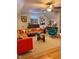 Spacious living room with an inviting sectional sofa, stylish mid-century decor, and a bright, airy atmosphere at 601 Aiken Pkwy, Fuquay Varina, NC 27526