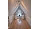 Compact office space in a converted attic, showcasing a built-in desk and natural light, a unique work area at 601 Aiken Pkwy, Fuquay Varina, NC 27526