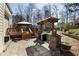 Landscaped backyard with a patio, pergola, and deck, perfect for outdoor living at 604 Chadbourne Dr, Durham, NC 27703