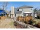 Expansive backyard featuring a well-maintained deck, patio, and lush landscaping, ideal for outdoor entertaining and relaxation at 604 Chadbourne Dr, Durham, NC 27703