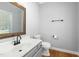 Modern half bath featuring a stylish vanity and mirror at 604 Chadbourne Dr, Durham, NC 27703