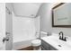 Bathroom features white vanity, tub, and shower at 604 Chadbourne Dr, Durham, NC 27703