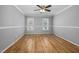 Bright bedroom with hardwood floors and neutral paint at 604 Chadbourne Dr, Durham, NC 27703