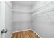Walk-in closet features wooden floors and wire shelving at 604 Chadbourne Dr, Durham, NC 27703